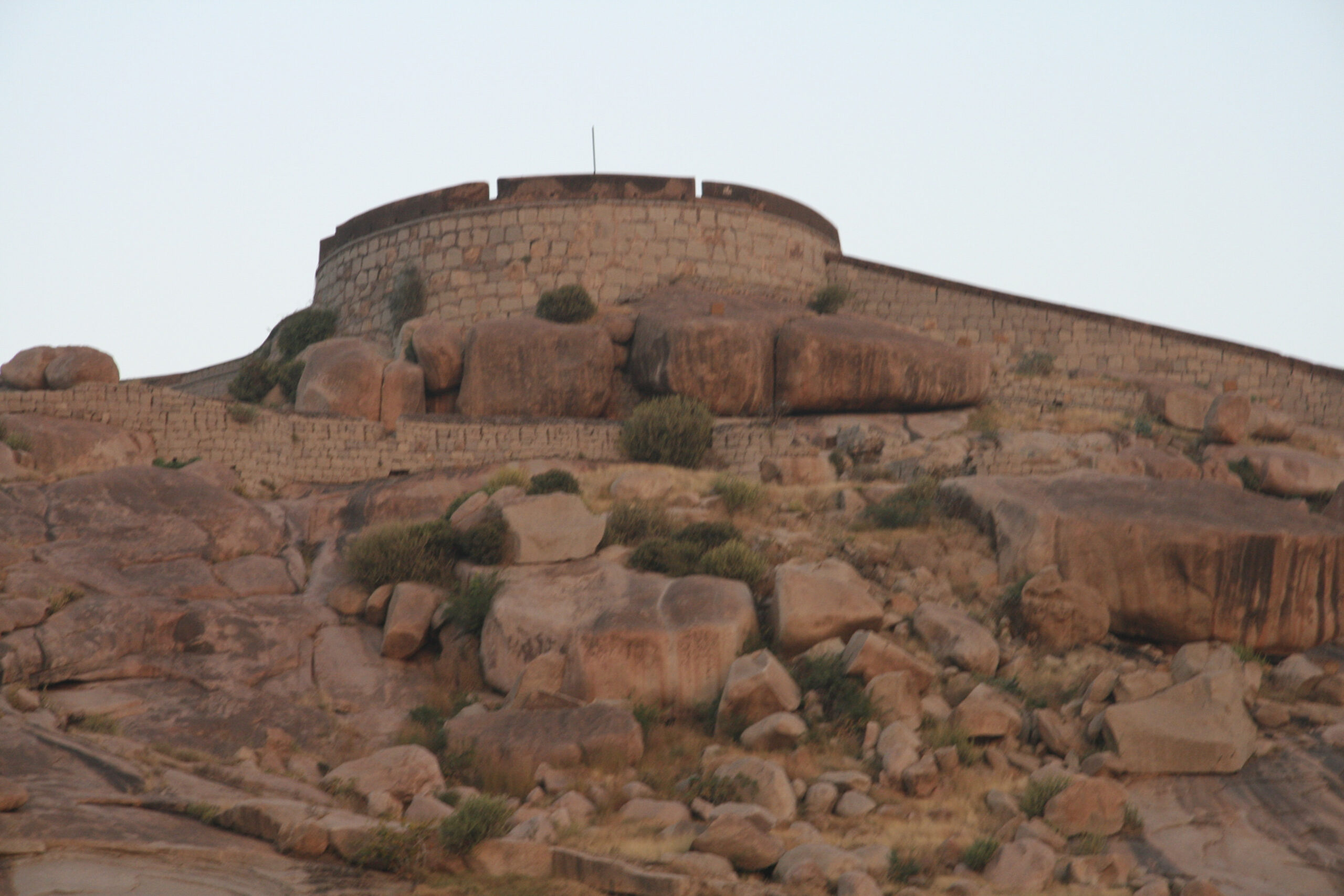Fort ruins on a rocky hilltop in Ballari near Hampi