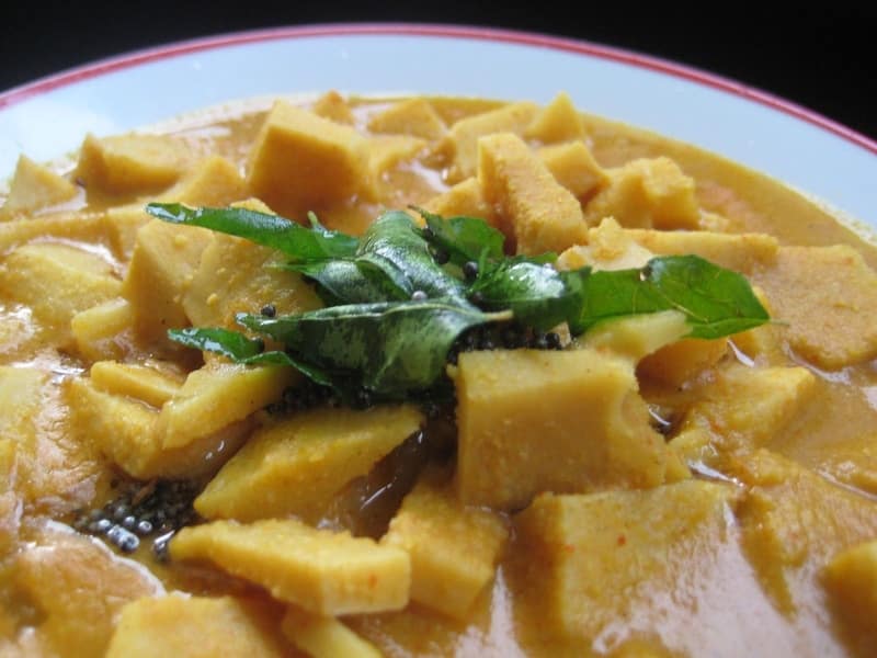 Traditional Coorg bamboo shoot curry with coconut garnish