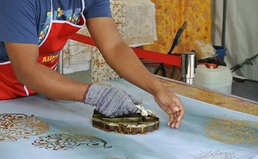 Exquisite Bhopali Zardozi embroidery work, showcasing intricate gold and silver thread craftsmanship in Bhopal.
