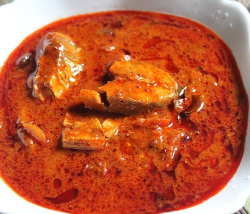 Spicy Andhra fish curry served in earthenware.