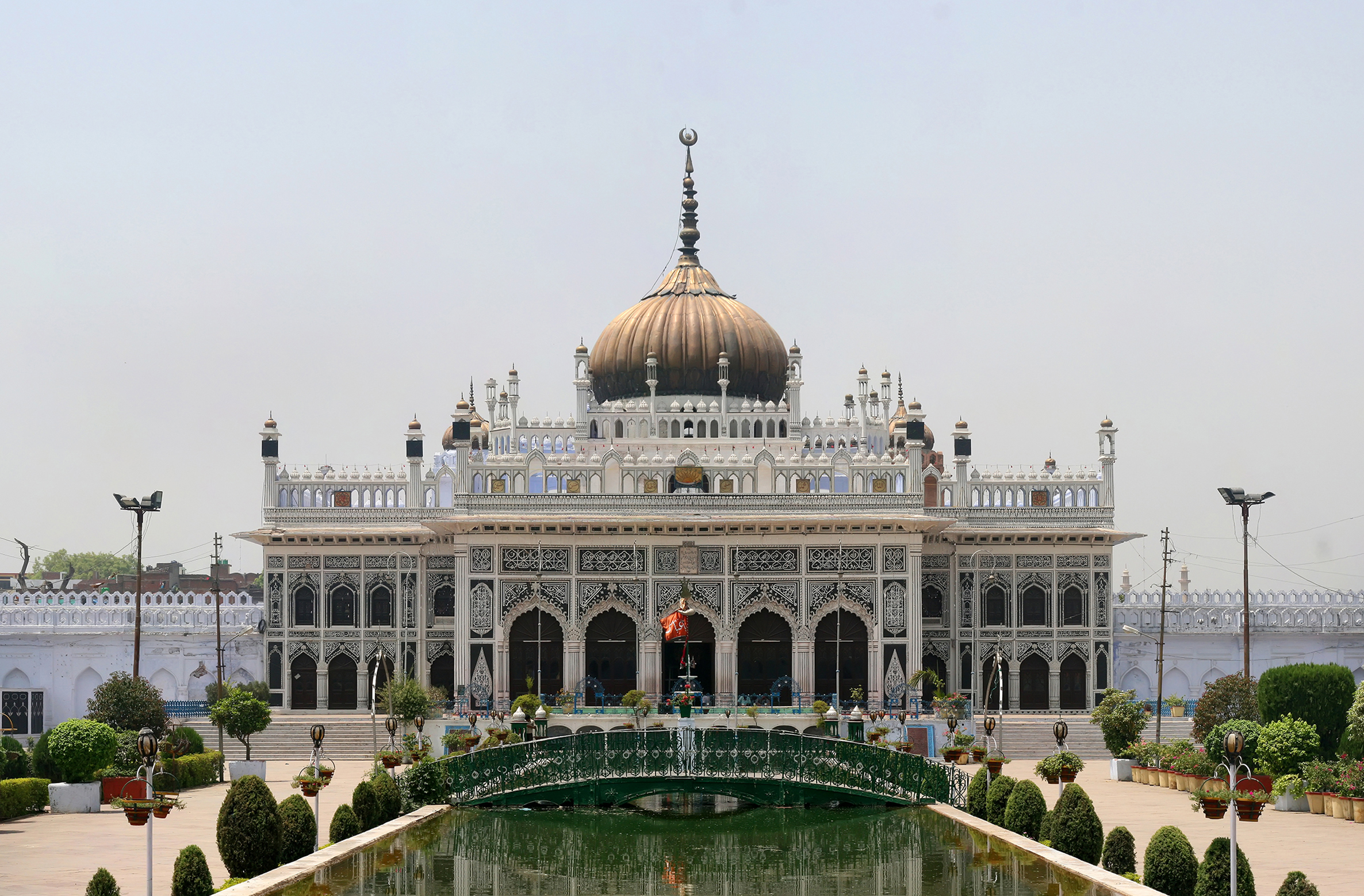Ornate Chota Imambara shining under sunlight with decorative domes in Lucknow