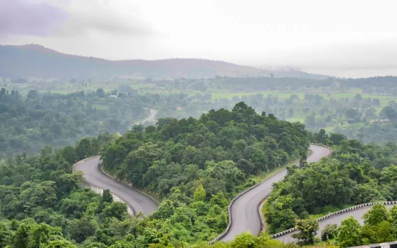 City Page Ranchi presents Patratu Valley - a breathtaking serpentine highway winding through lush green hills and misty landscapes, perfect for road trips and photography