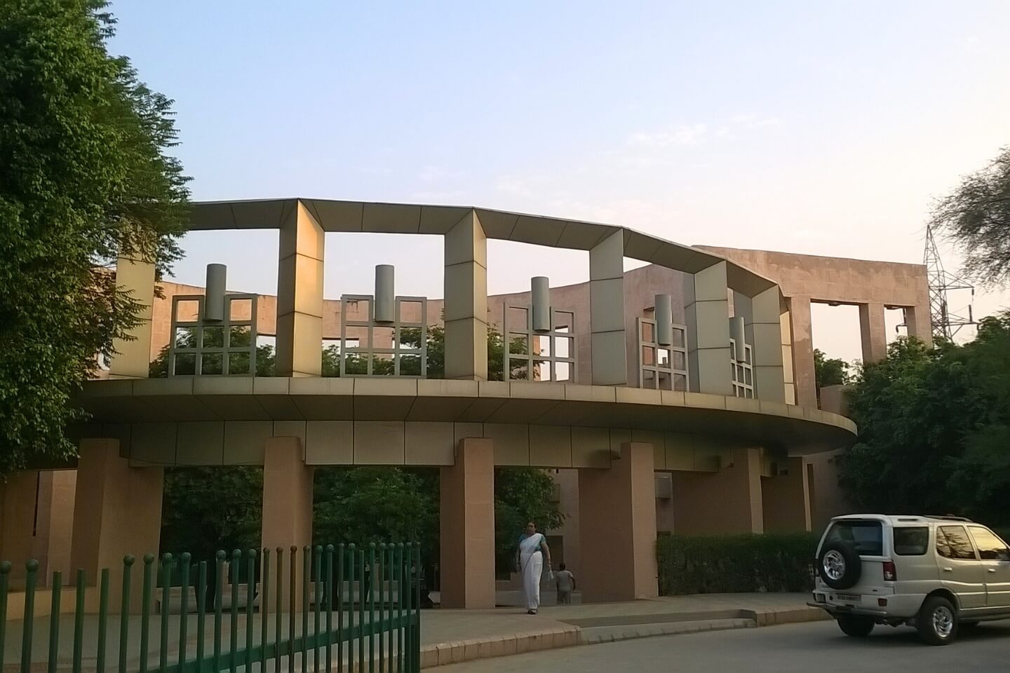 Peaceful walking trail with tall trees and gardens, Lucknow