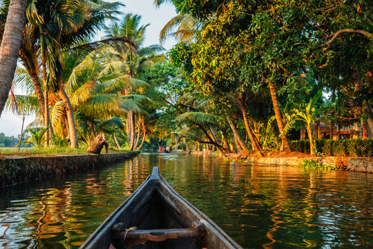 City Page Thiruvananthapuram: Traditional houseboat gliding through Kerala’s scenic backwaters.