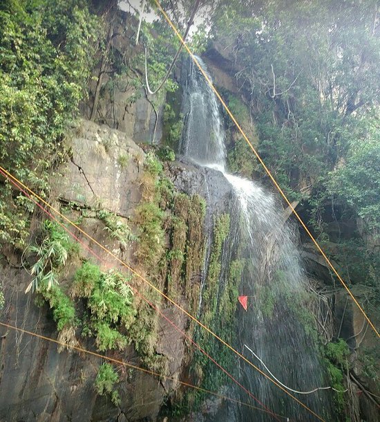 Water cascading down Kakolat's rocky cliffs