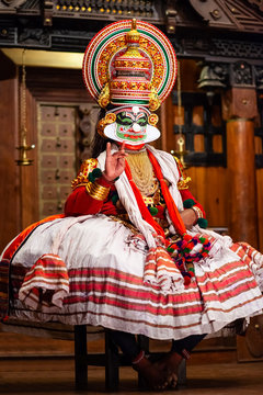 City Page Thiruvananthapuram: Vibrant Kathakali dancer in intricate makeup and attire.