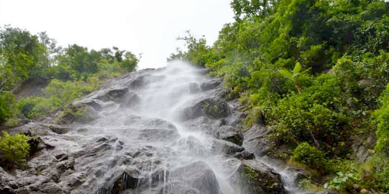 Cascading waters amidst dense forests at Katiki Waterfalls, highlighted on our city page Visakhapatnam nature guide.