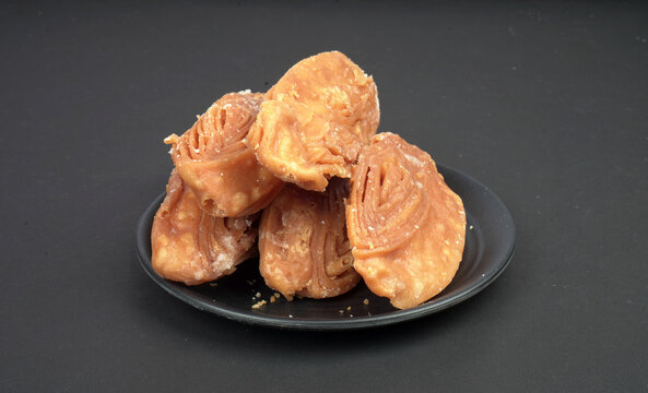 Layered Khaja pastry stacked in a pyramid shape