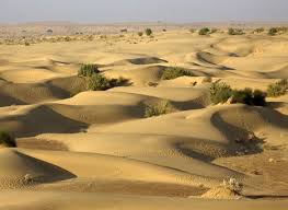 Traditional huts and sand dunes in Khuri near Jaisalmer
