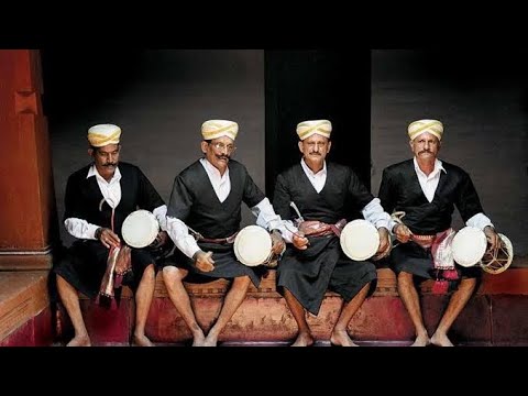 Coorg City Page displays traditional musicians with drums