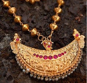 Traditional silver peacock pendant necklace from Coorg