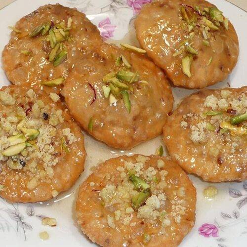 Sweet Mawa Kachori dessert on a plate in Jaisalmer sweet shop