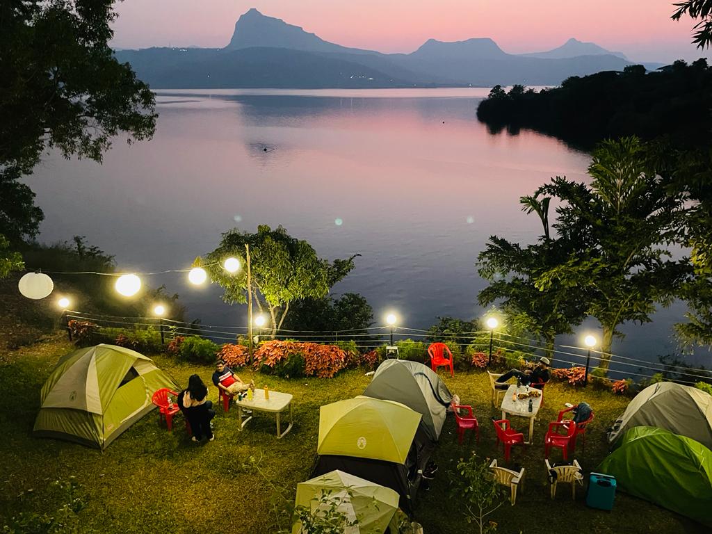 Pawna Lake near Pune is a scenic camping and picnic destination.