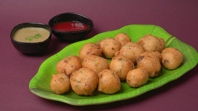 Crispy golden Punugulu, a beloved snack featured on our city page Visakhapatnam culinary guide.