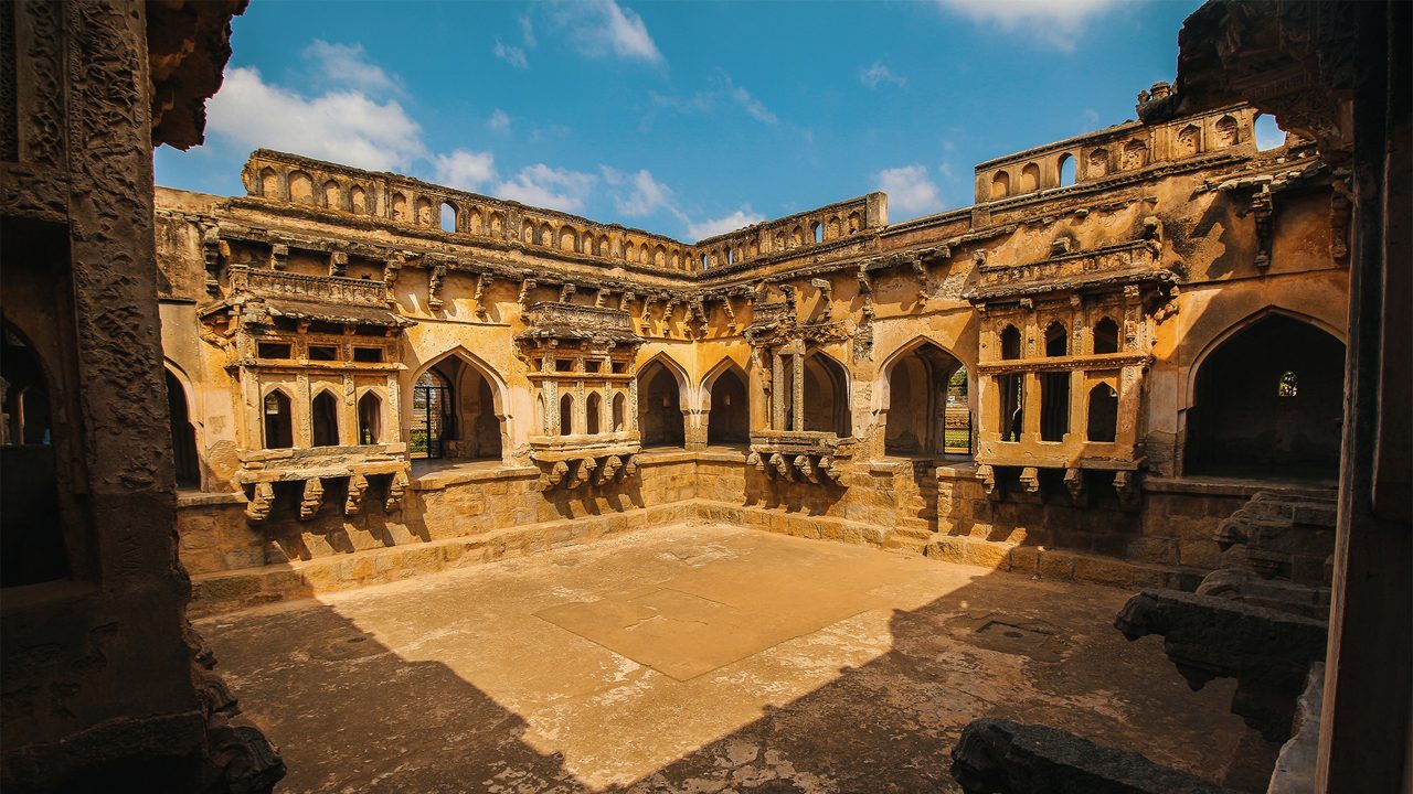 Ornate Queen’s Bath in Hampi surrounded by arched corridors
