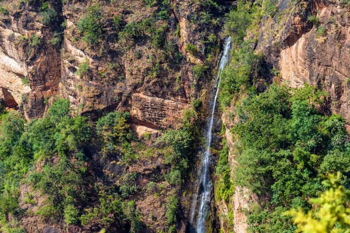 Thundering waterfall plunging down cliff face