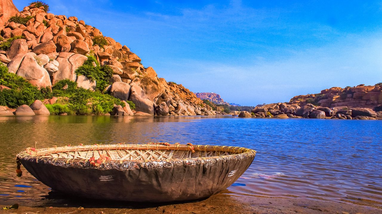 Sanapur Lake with large boulders and coracle rides in Hampi