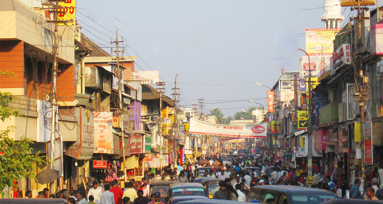 City Page Thiruvananthapuram: Bustling Chalai Market with spices, textiles, and local crafts.