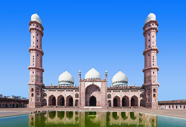 Taj-ul-Masajid in Bhopal - one of Asia's largest mosques with towering white minarets, pink façade, and a grand courtyard reflecting Islamic architecture.