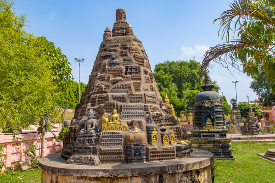 Visitors practicing yoga near Gaya's Mahabodhi Temple