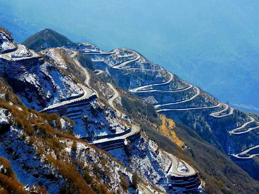 The journey itself, with hairpin bends and misty landscapes, is an unforgettable experience.