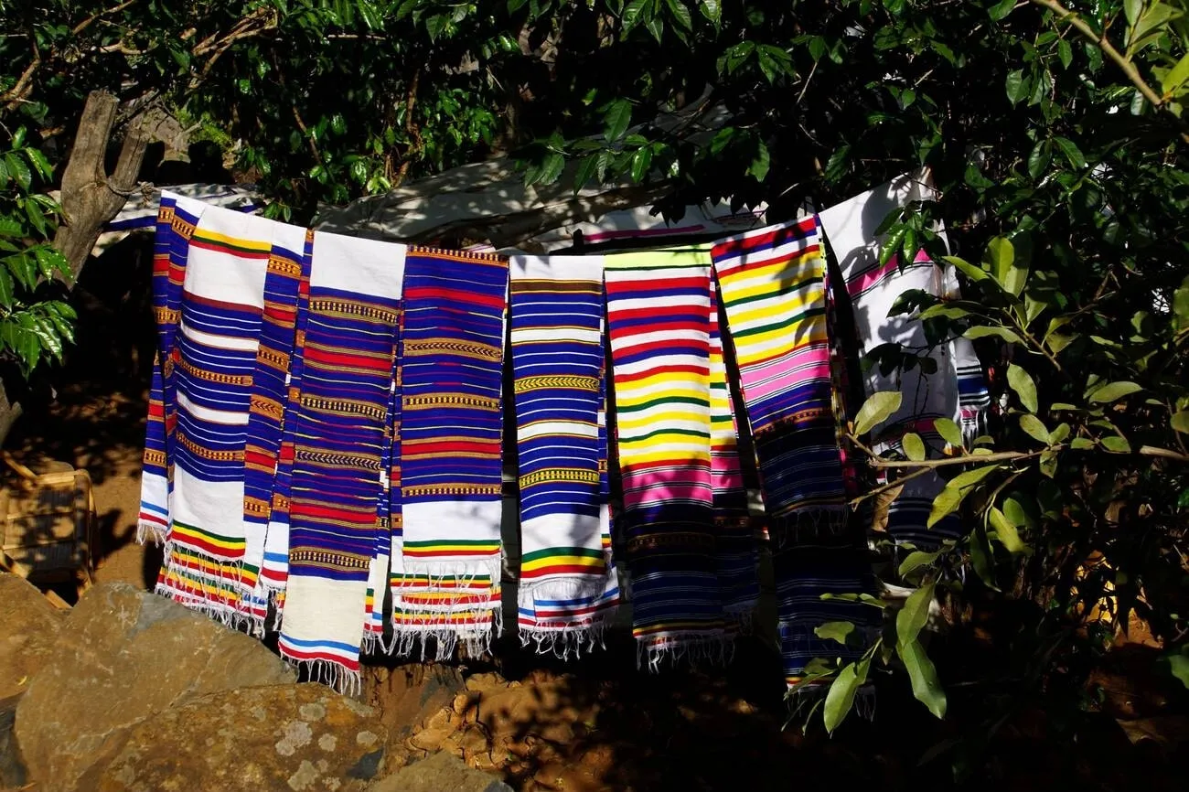 Handmade shawls and sweaters by the women of the town