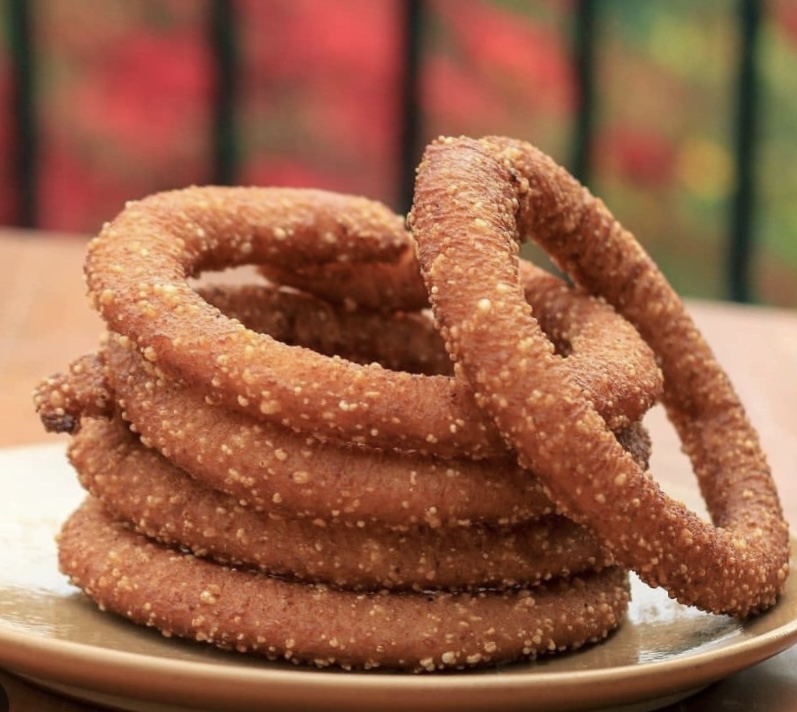 A circular shaped dish deep fried in oil.