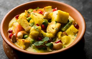 Aamat curry with bamboo shoots and mixed vegetables in an earthen pot