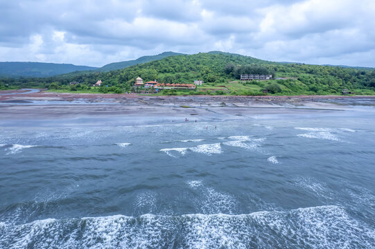 Anjarle Beach, a quiet coastal spot surrounded by cliffs.