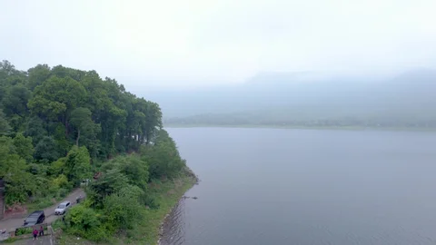 A family enjoying a paddle boat ride on the calm waters of Dimna Lake in Jamshedpur.