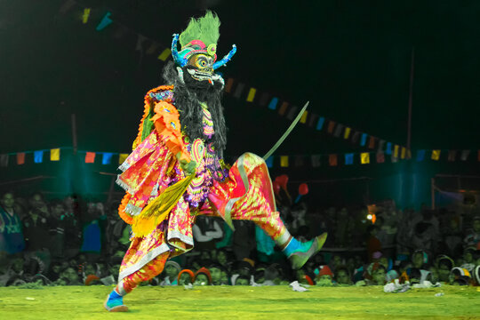 A dancer in a vibrant mask performing the dramatic Chhau dance in Jamshedpur.