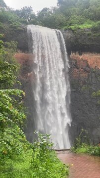 Chiplun Waterfall in Maharashtra, a scenic monsoon cascade surrounded by lush green Western Ghats forests.
