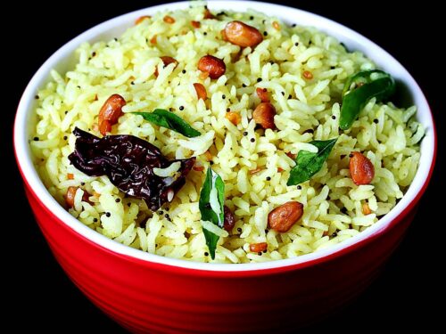 Bright yellow Chitranna with mustard seeds and curry leaves