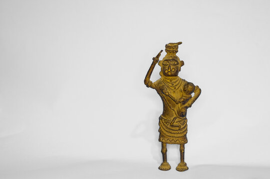 Intricate handcrafted Dhokra metal figurines and jewelry on display.