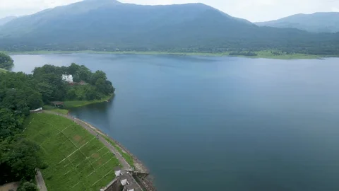 The serene blue waters of Dimna Lake surrounded by hills in Jamshedpur.