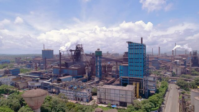 A guided tour group observing the steel manufacturing process inside a plant in Jamshedpur.