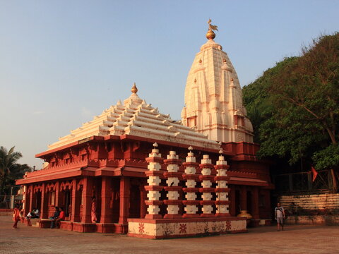 Sacred Ganpatipule Temple beside a pristine white-sand beach.