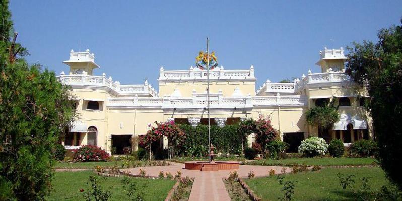 Historic Kanker Palace surrounded by forests, showcasing heritage and tribal culture.