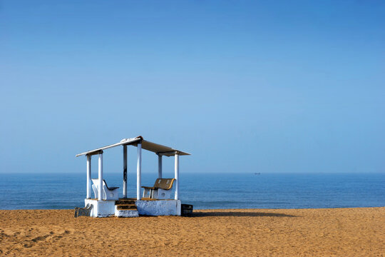 Mandvi Beach in Ratnagiri, a serene shoreline with clear blue waters.