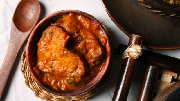 This fish curry has tomatoes or lemon to add the sourness