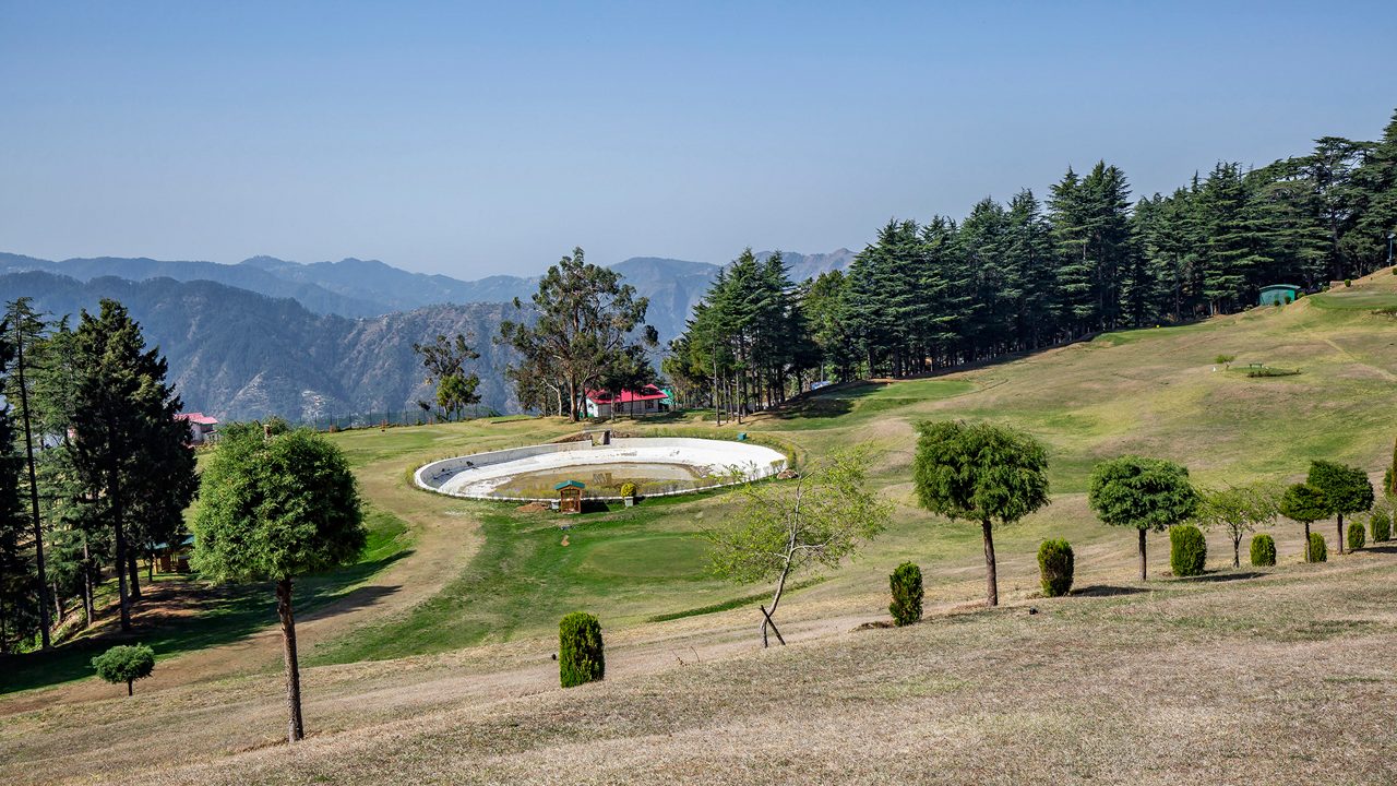 Naldehra Golf Course amid hills.