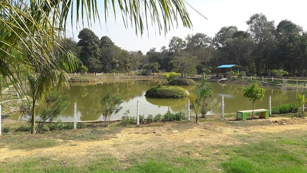 A serene green park with walking tracks and play areas, among the best places to visit in Rourkela.