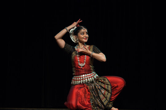 Odissi Dance performance, a classical Indian dance form originating from Odisha, showcasing graceful poses and intricate footwork
