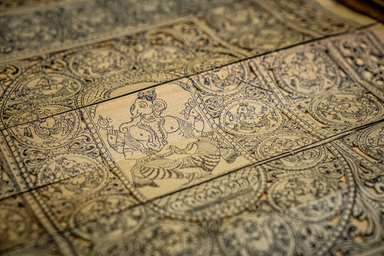 Vibrant Pattachitra art from Odisha, depicting mythological scenes on cloth with bold colors and intricate details.