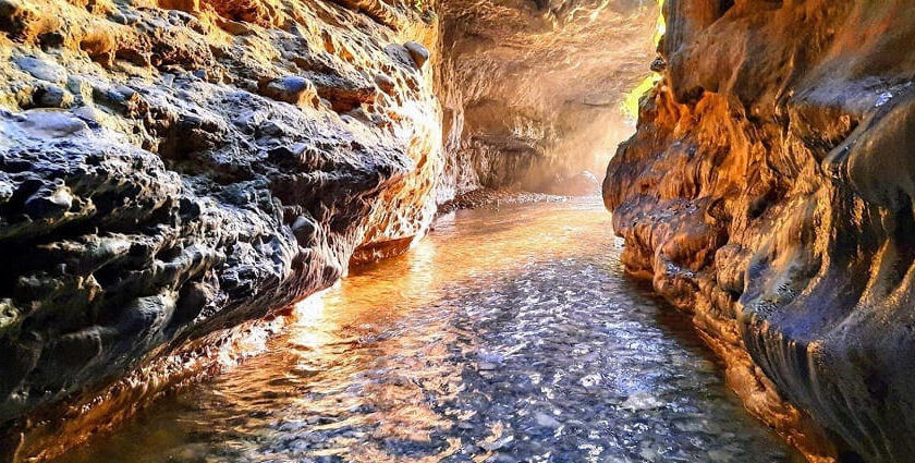 Water stream inside Robber’s Cave in Dehradun