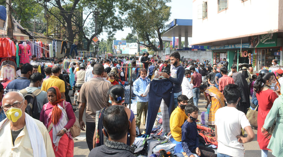 A bustling view of shoppers and stalls at the famous Sakchi Market.