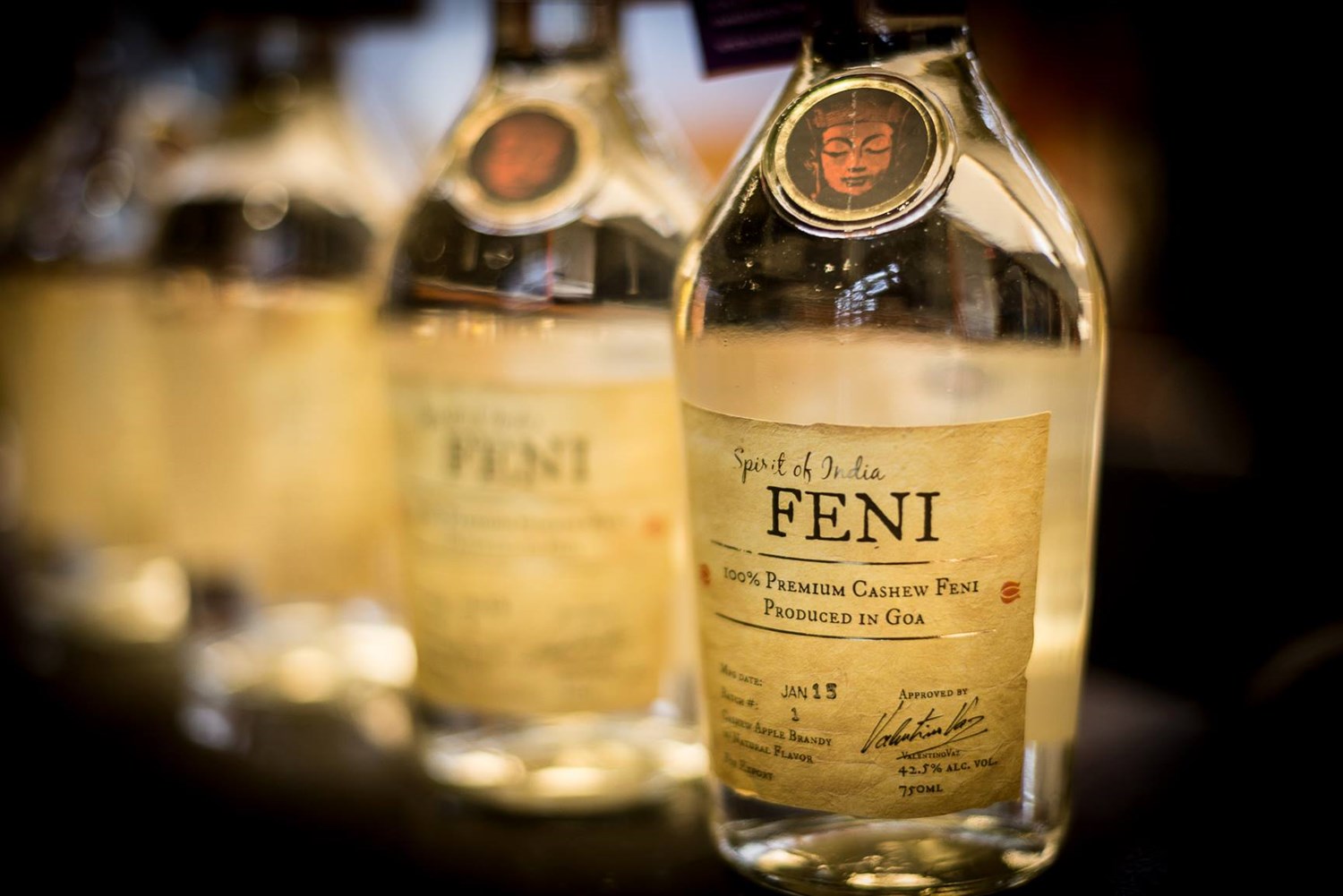 Glass of cashew feni