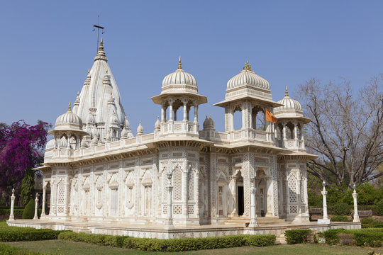 The ornate, dome-shaped royal chhatris (cenotaphs) set beside a serene lake in Shivpuri.