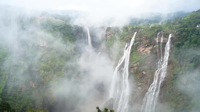 A dramatic segmented waterfall plunging 253 meters down a steep cliff face in four distinct streams.