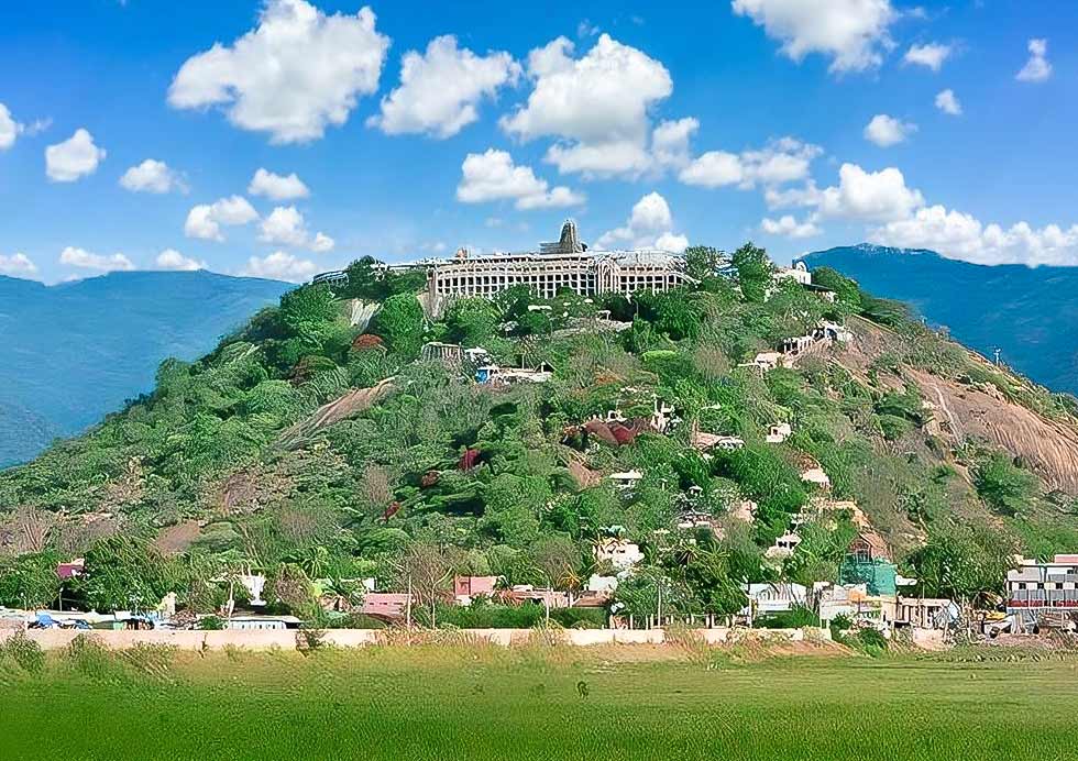 A view of the Palani Hill and the temple dedicated to Lord Murugan, accessed by a steep climb or cable car.